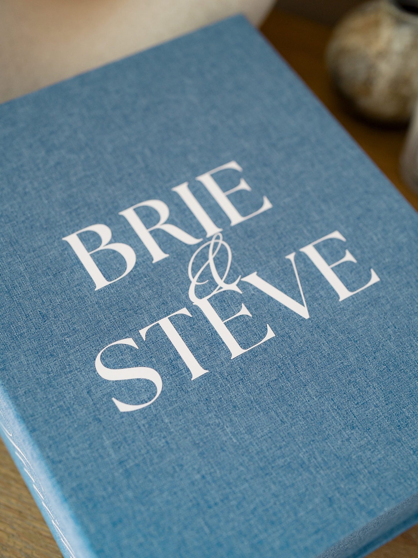 French Blue | Close-up of white vinyl personalization on linen cover